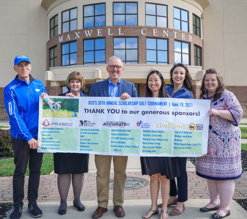 OCU Staff with Sponsorship Thank-You Banner