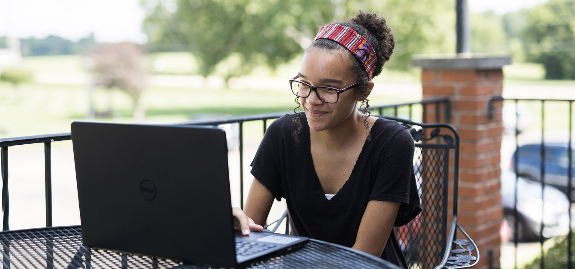 Student On Campus Outside with Laptop