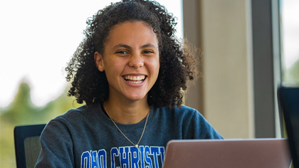 Ohio Christian University Student with a laptop